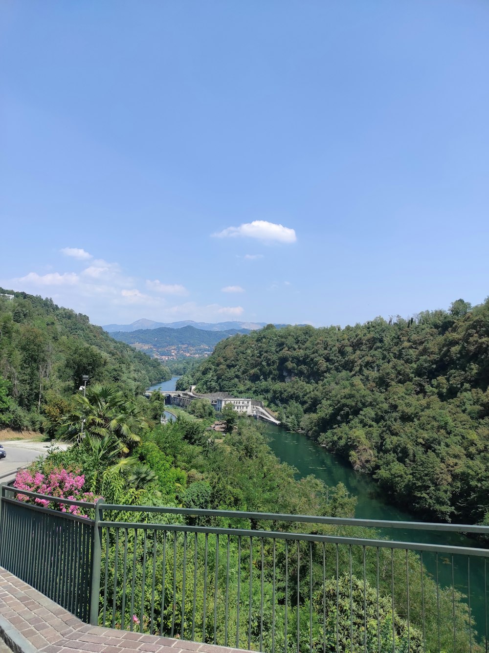 a view of a river and a bridge from a balcony