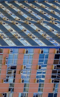 Before and after shots of a building’s façade with improved insulation solutions.