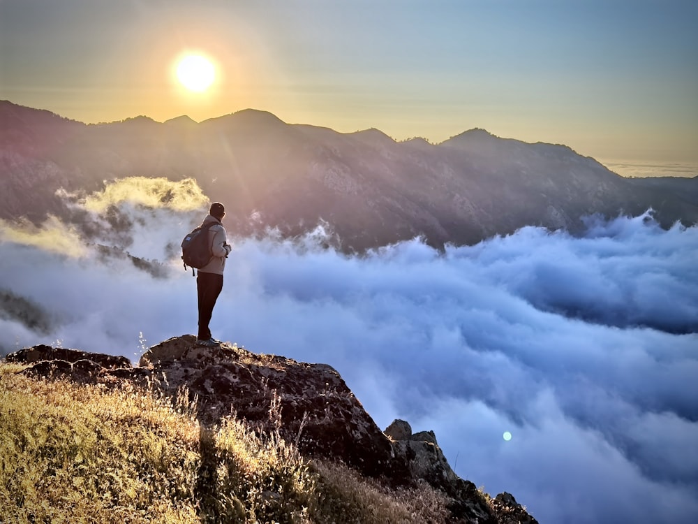 a man standing on a mountain top