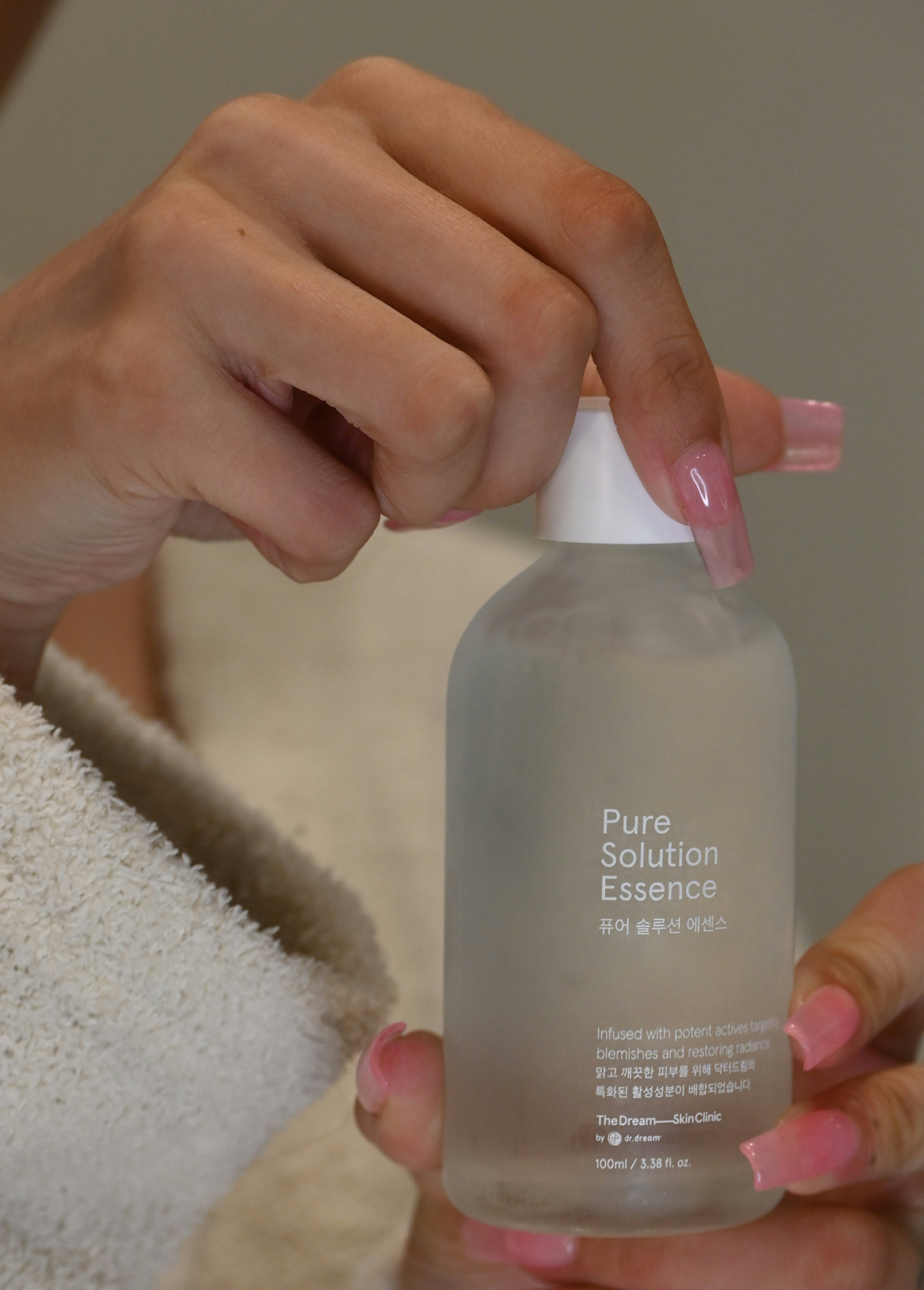 a person holding a bottle