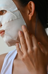 a person holding the hand to the face