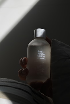 a person holding a bottle