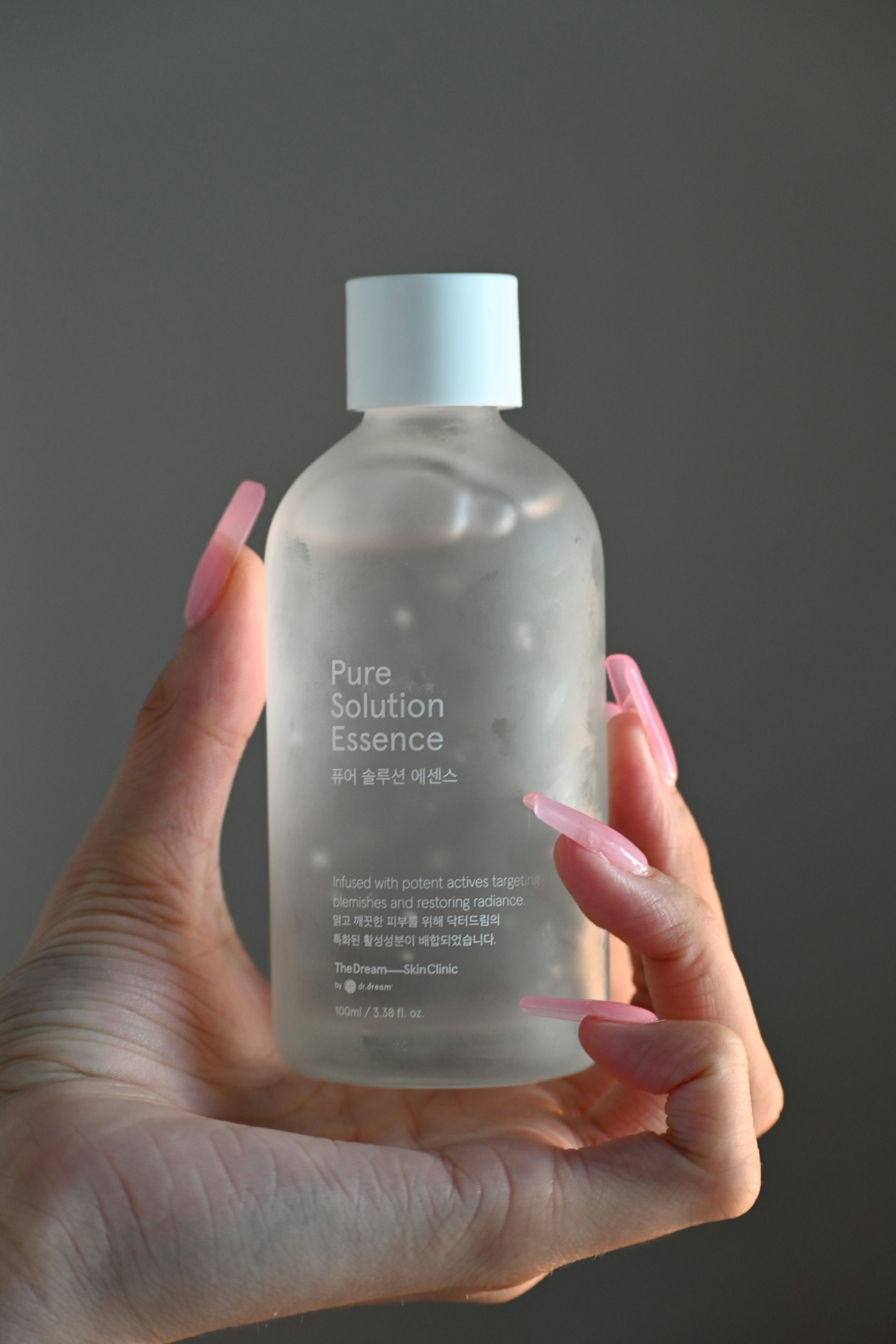 a person holding a bottle