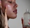 a person holding a bottle