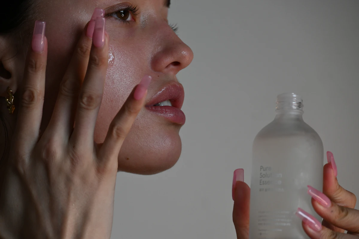 Person holding a gentle serum bottle