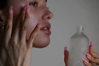 a person holding a bottle