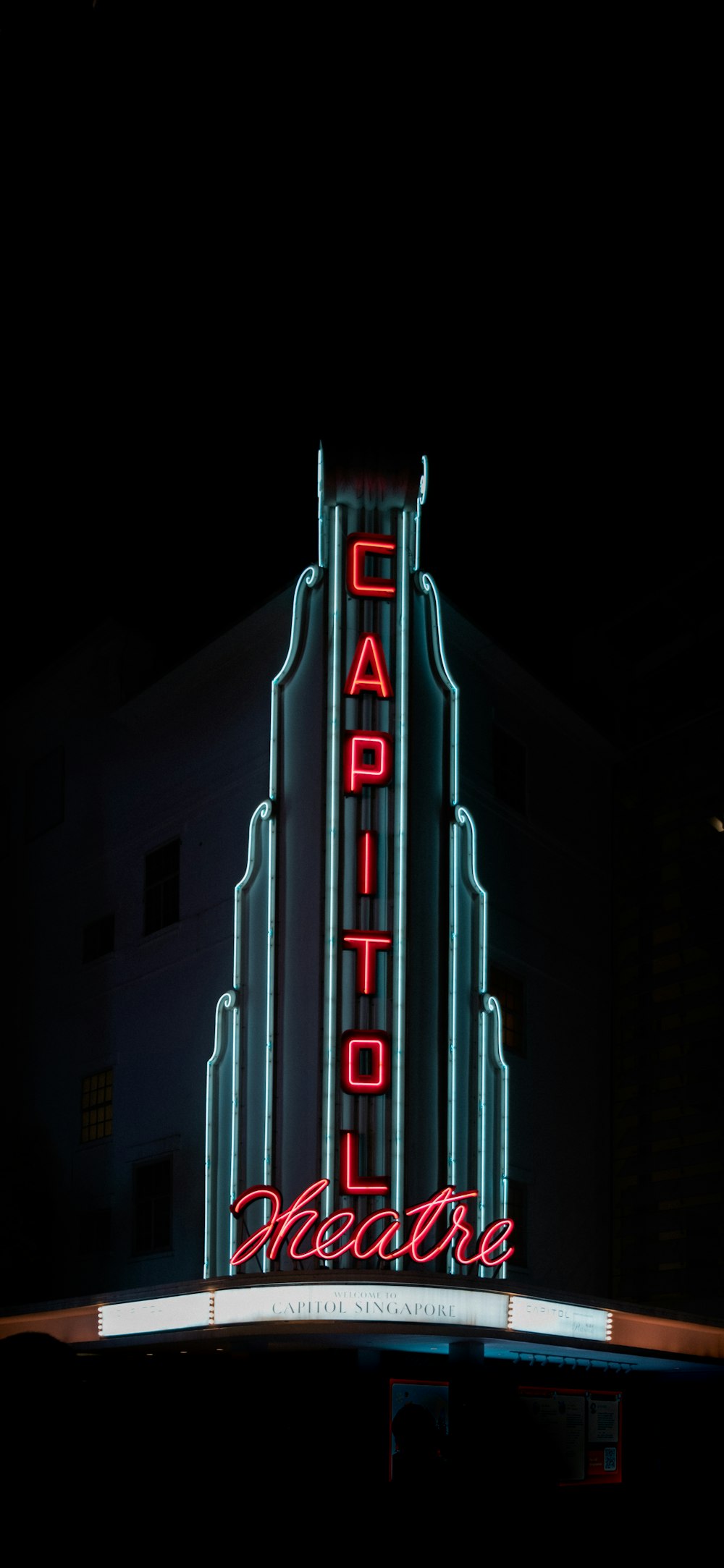 a tall building with a sign on it