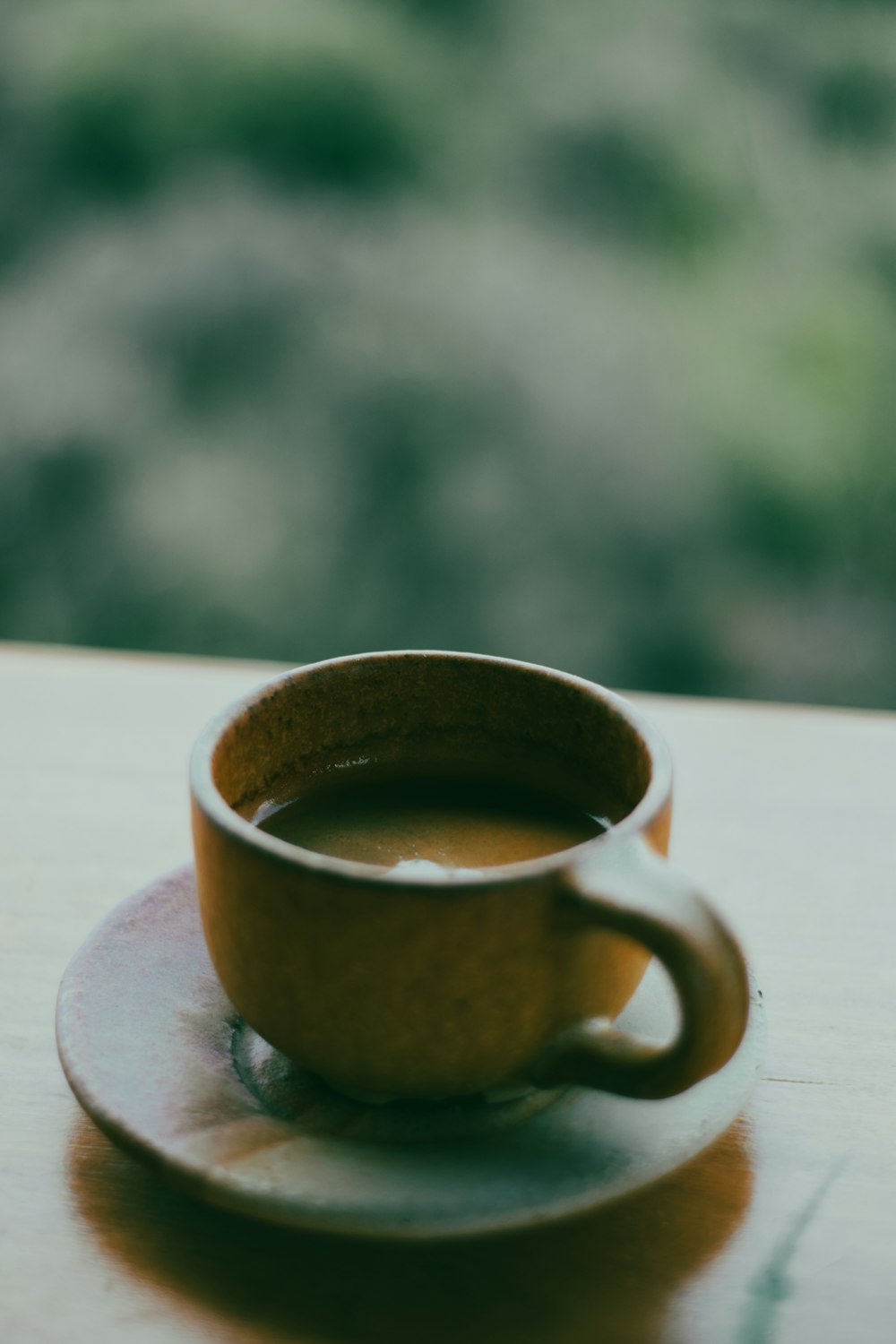 a cup of coffee on a saucer