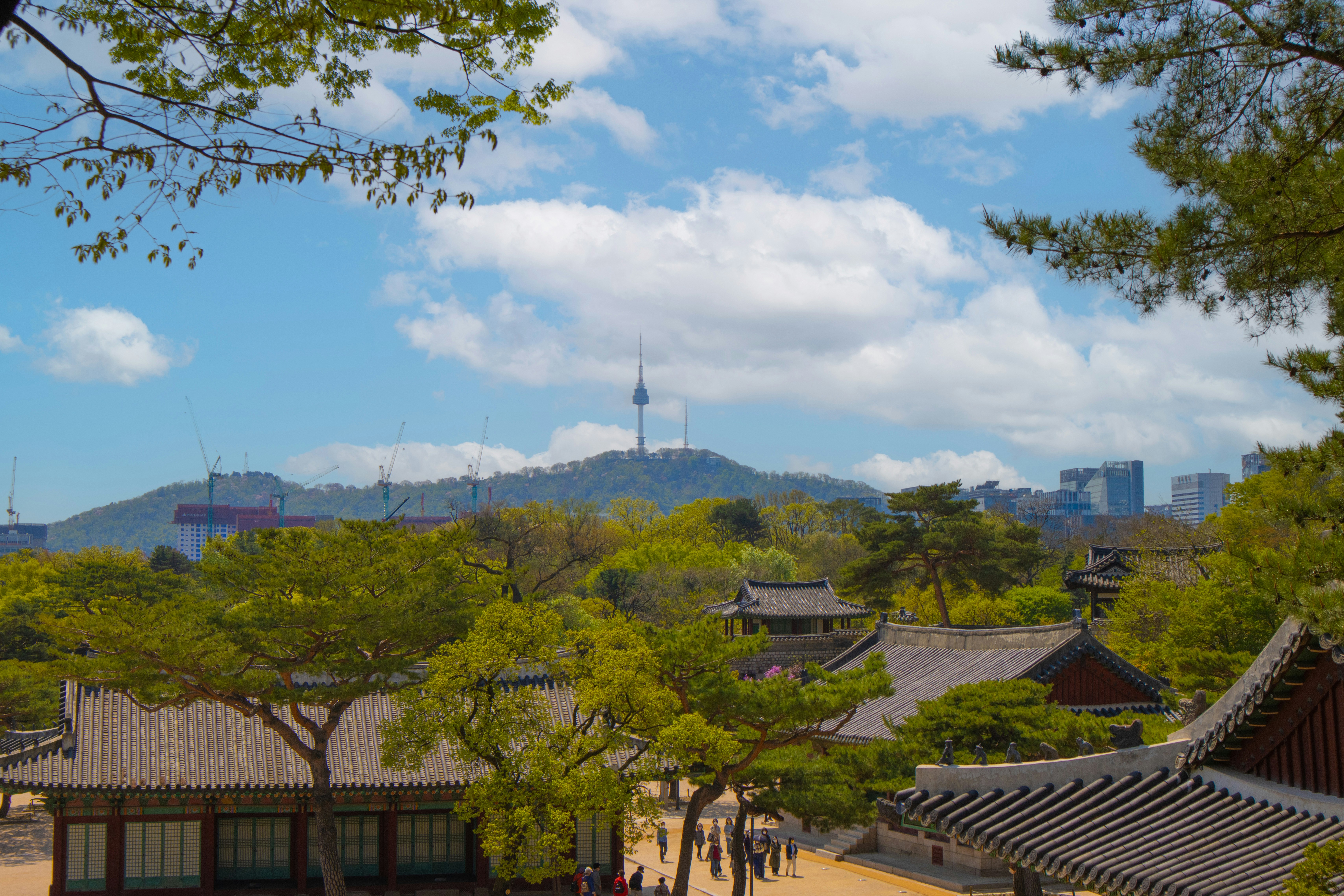 a city with a mountain in the background, 