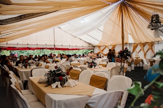 a group of people sitting at tables