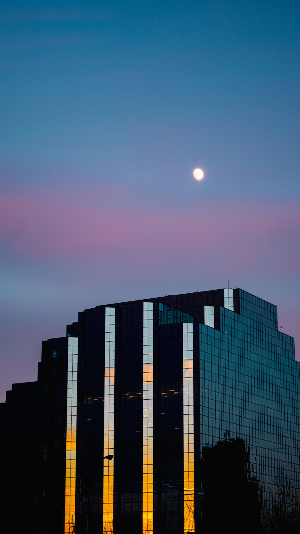 a building with a moon in the sky