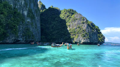 Crystal-clear turquoise waters surrounding the famous Komodo Island with boats anchored nearby