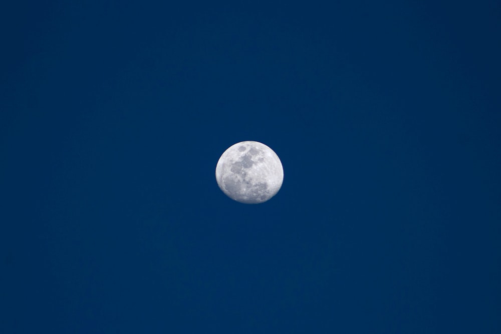 a moon in a blue sky