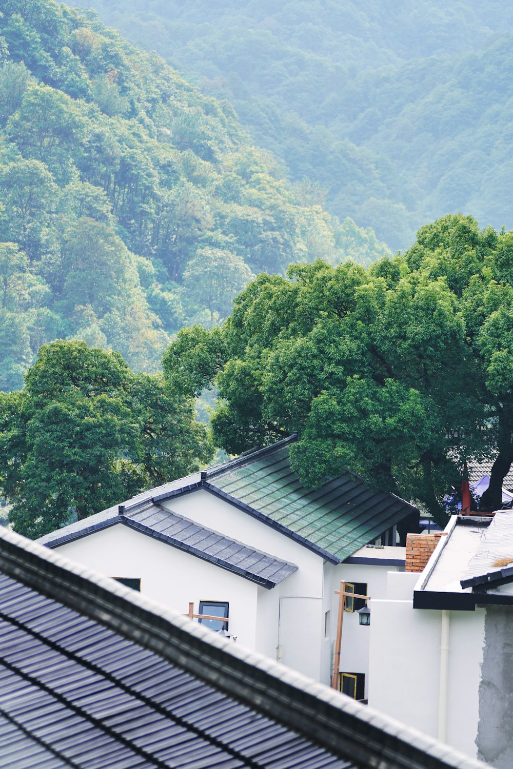 a building with a hill in the background