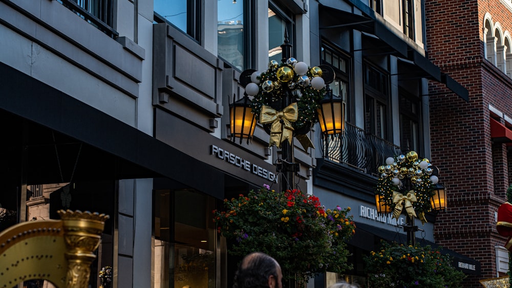 a street with a lamp post and flowers on it