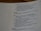 A close-up view of a page from a book, featuring text from the Bible, specifically Song of Songs 8:3. The text is presented in a structured format, with section headings such as 'Friends' and 'She'. The focus is mainly on the center and right side of the page.