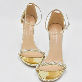 Elegant sandal with subtle metallic accents perfect for special occasions.
