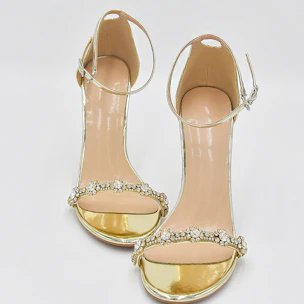 Elegant sandal with subtle metallic accents perfect for special occasions.