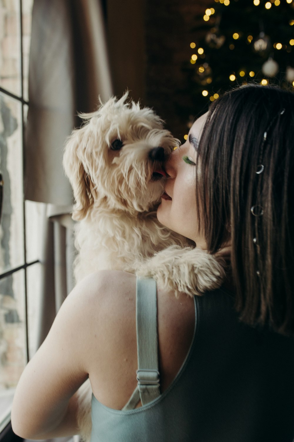 a woman holding a dog