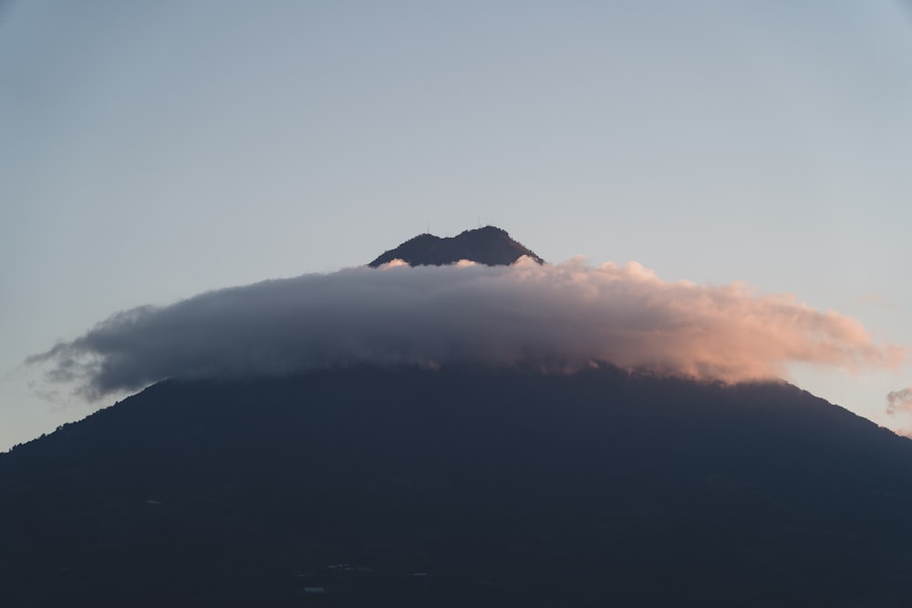 a mountain with clouds