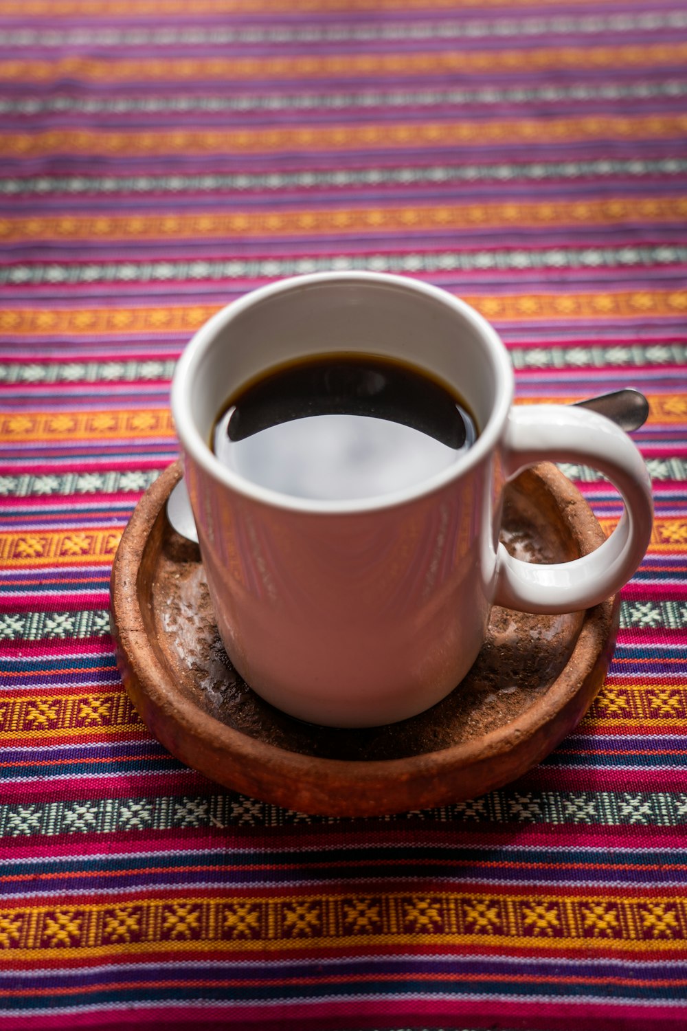 a cup of coffee on a saucer