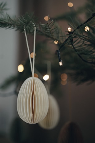 Close-up of a delicate paper ornament inspired by olive leaves