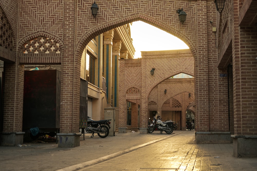 a brick building with a motorcycle parked in the front