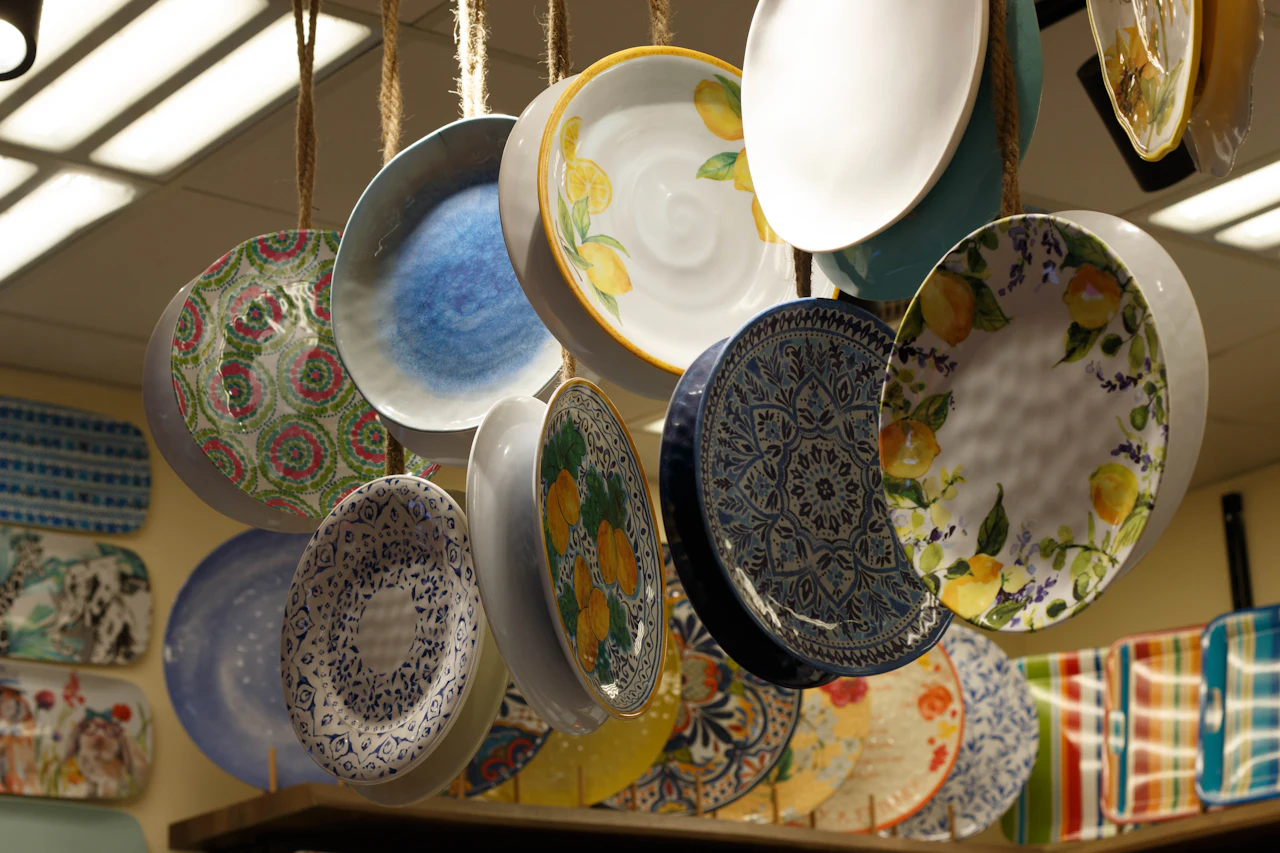 Hand-painted ceramic plates hanging in a shop at Global Village