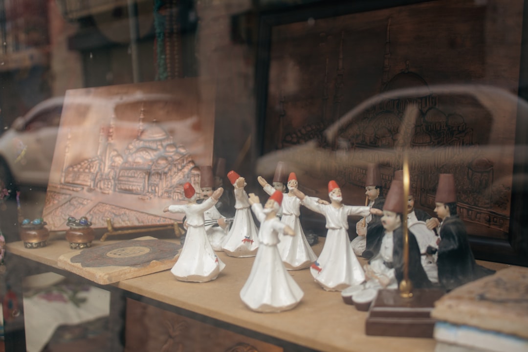 a group of white chess pieces, Whirling dervishes decorations in shop