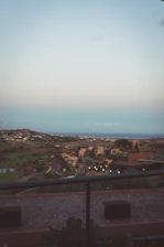 A panoramic view of a freshly developed land parcel at sunset, highlighting natural contours and green spaces.