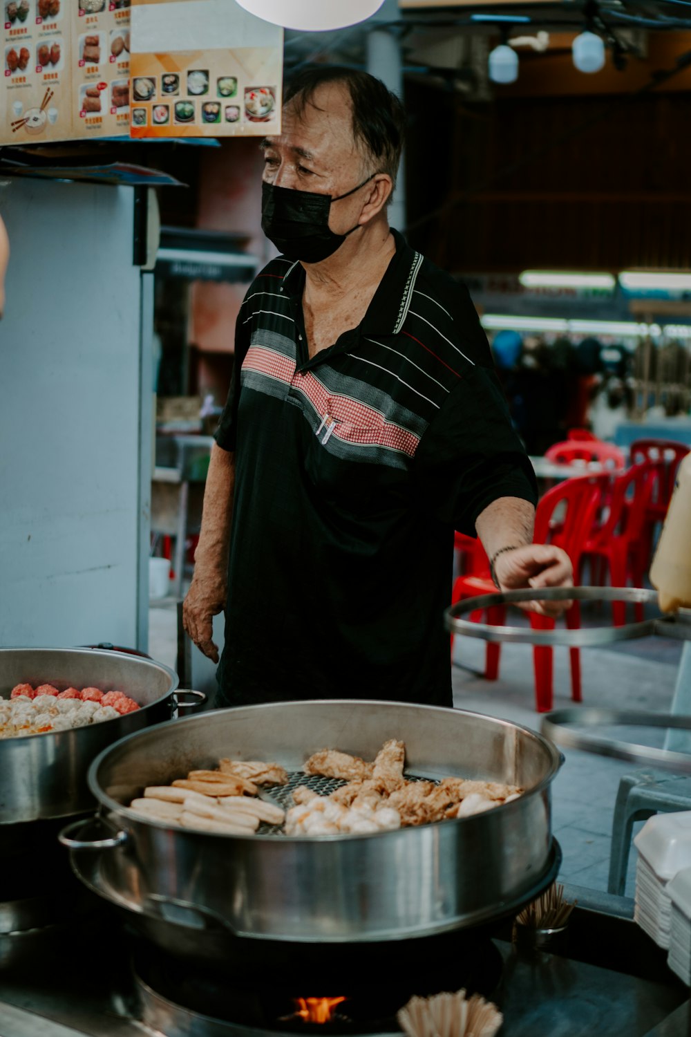 a person cooking food in a restaurant