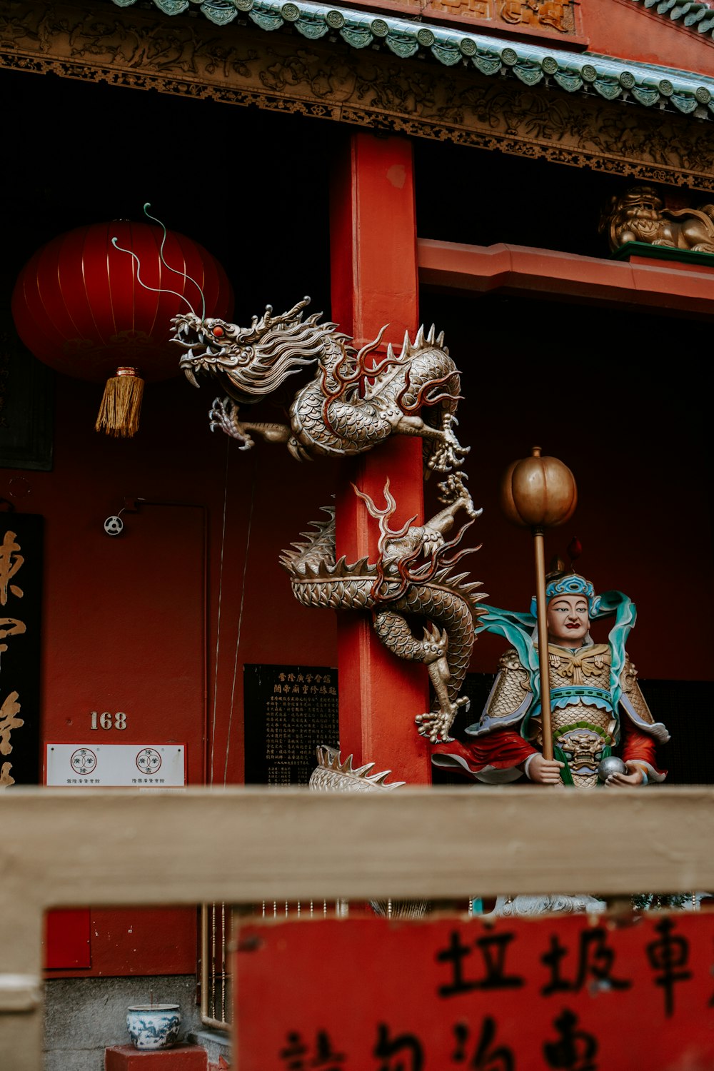 a statue of a person with a bird on the head