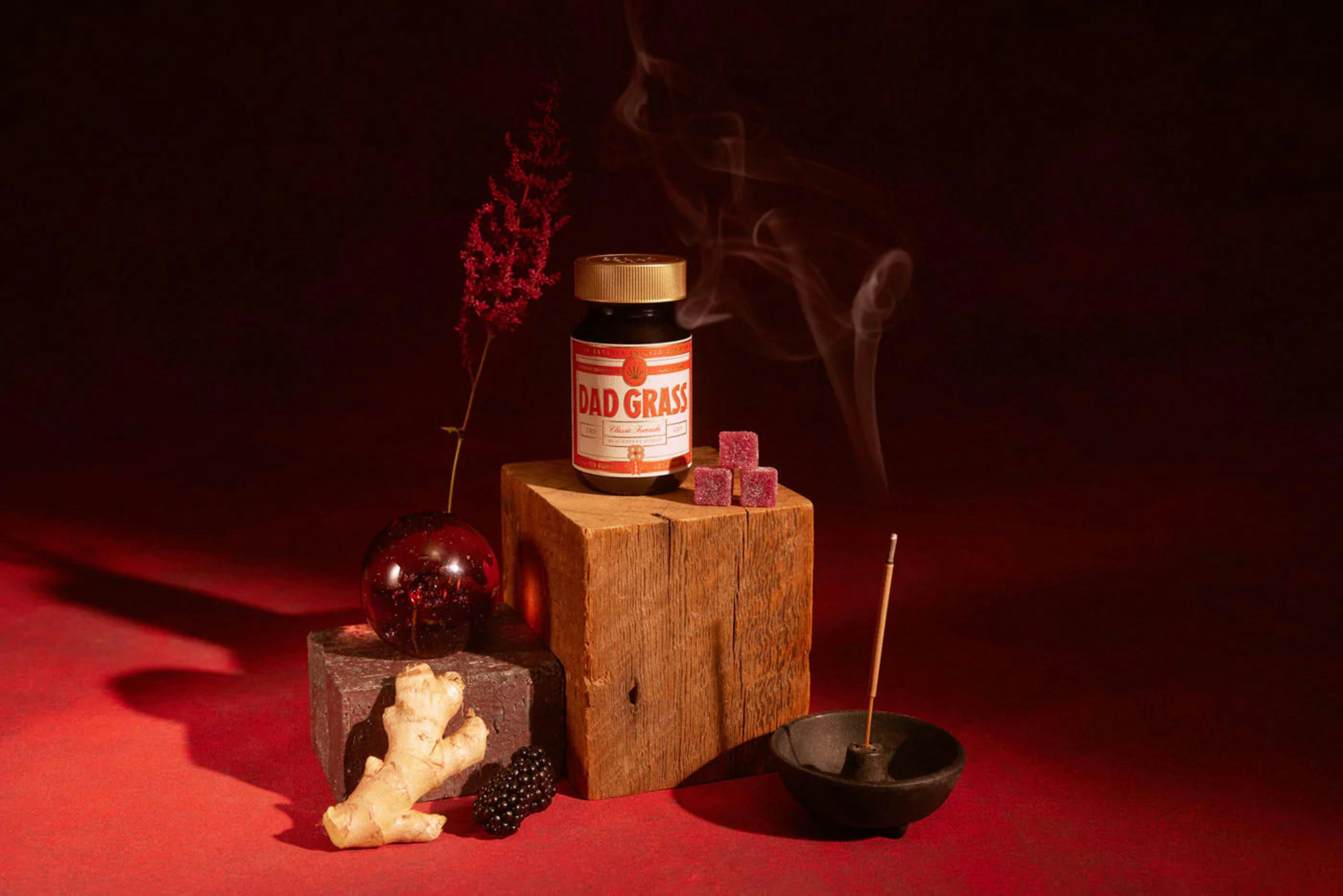 a few wooden objects with sticks and a bottle of liquor