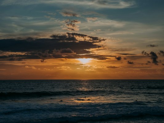 Sunset at Canggu, where the beach clubs run from the afternoon into the night — Bali, Indonesia