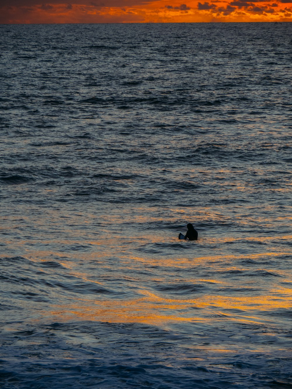 a person surfing in the sea