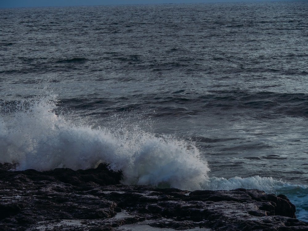 waves crashing on rocks