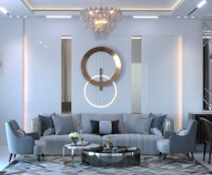 a room with a couch and chairs