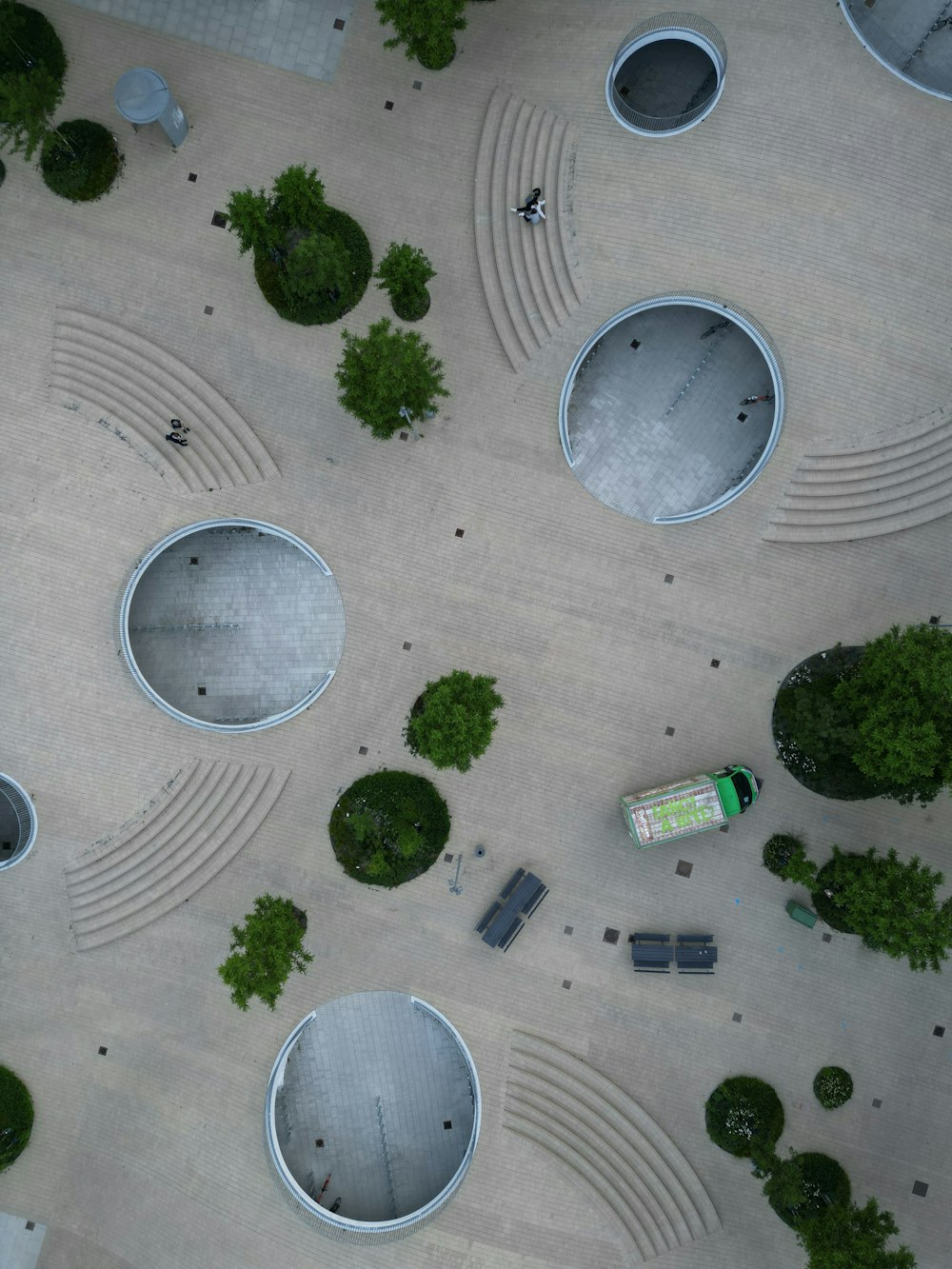 a group of people walking on a paved area