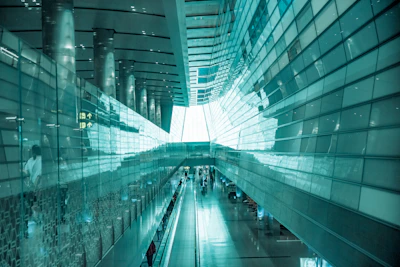 A sleek, futuristic apartment lobby shining with spotless floors and polished surfaces.