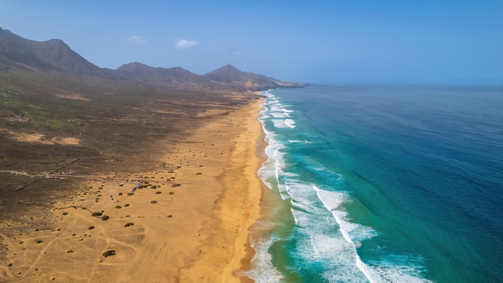 a beach with sand and water