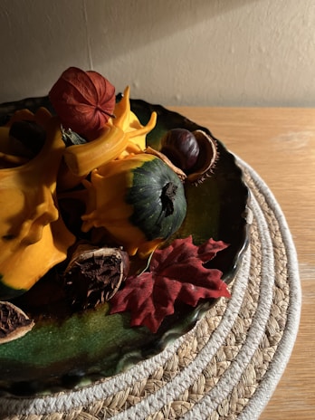 A serene display of handcrafted porcelain and lucky gourds arranged on a wooden table bathed in soft natural light.