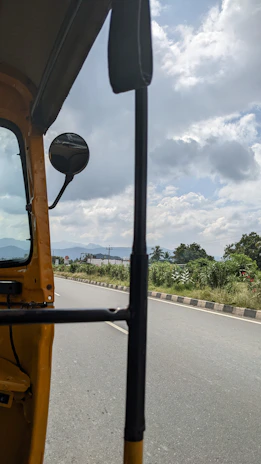 A scenic view of a cab driving through the vibrant streets connecting Ranchi to Jamshedpur.
