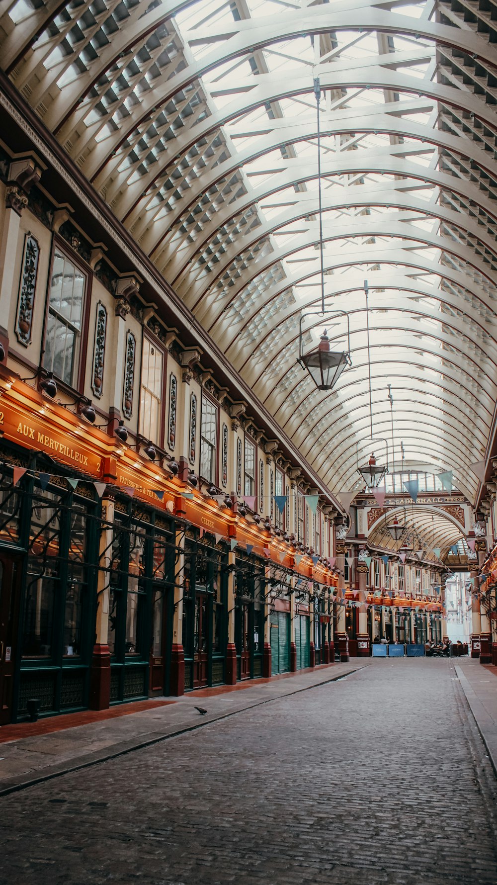 a large building with many windows with Leadenhall Market in the background