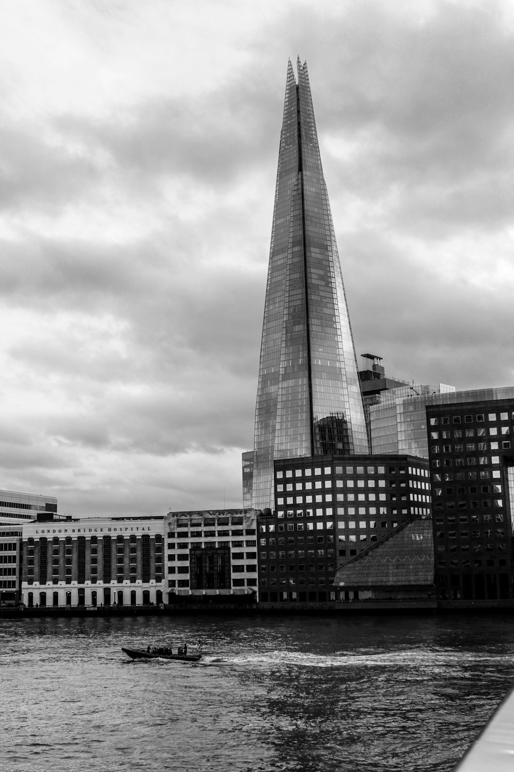 a tall building by the water