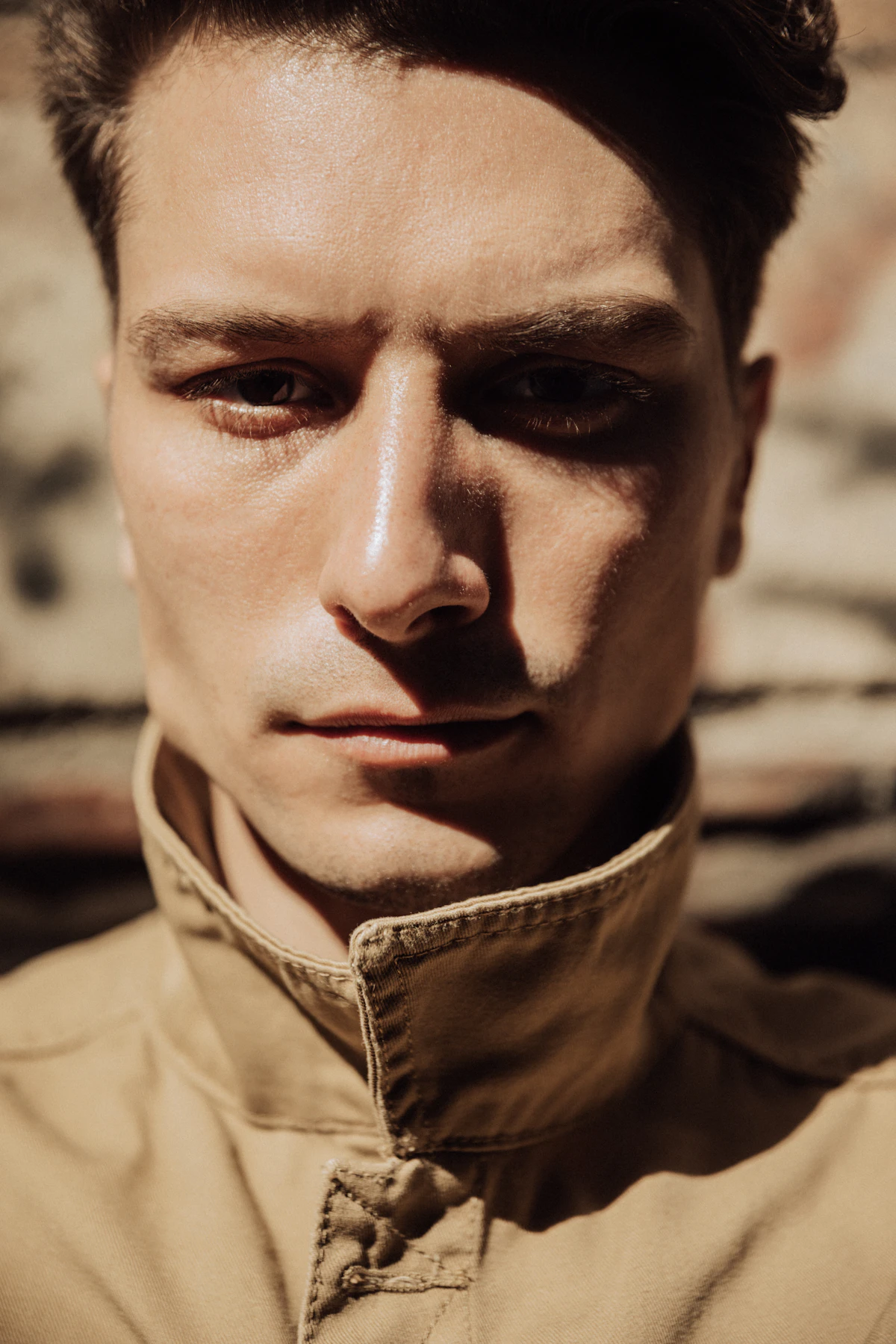 Portrait of a man with a serious, thoughtful expression, illustrating questions about TRT and personality changes.