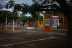 a street with benches and trees