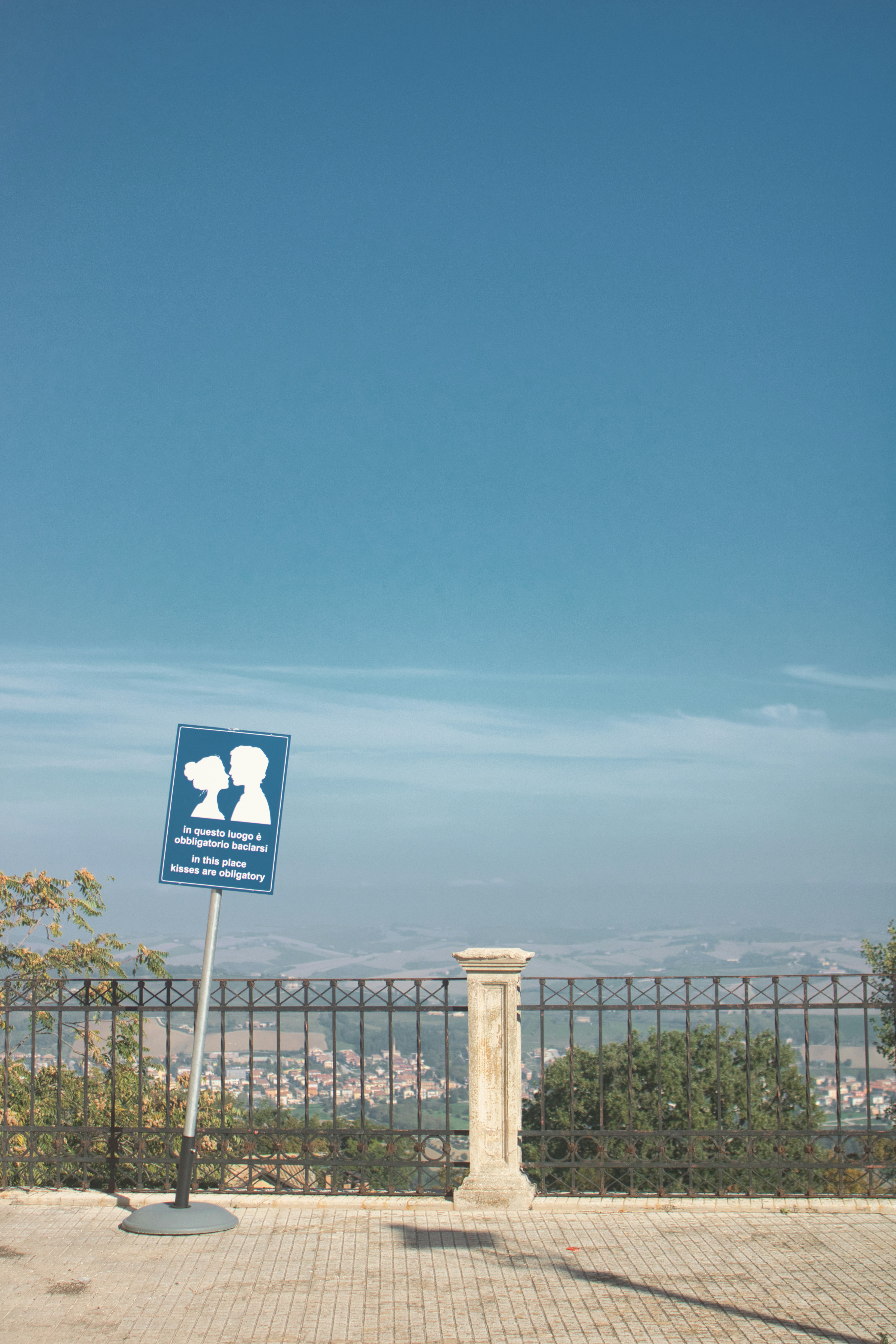 a sign on a sidewalk