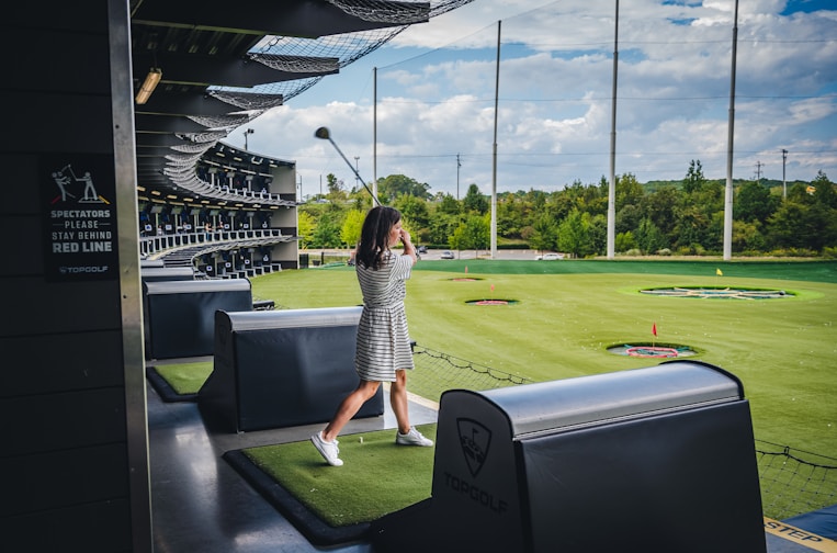 a person standing on a golf course