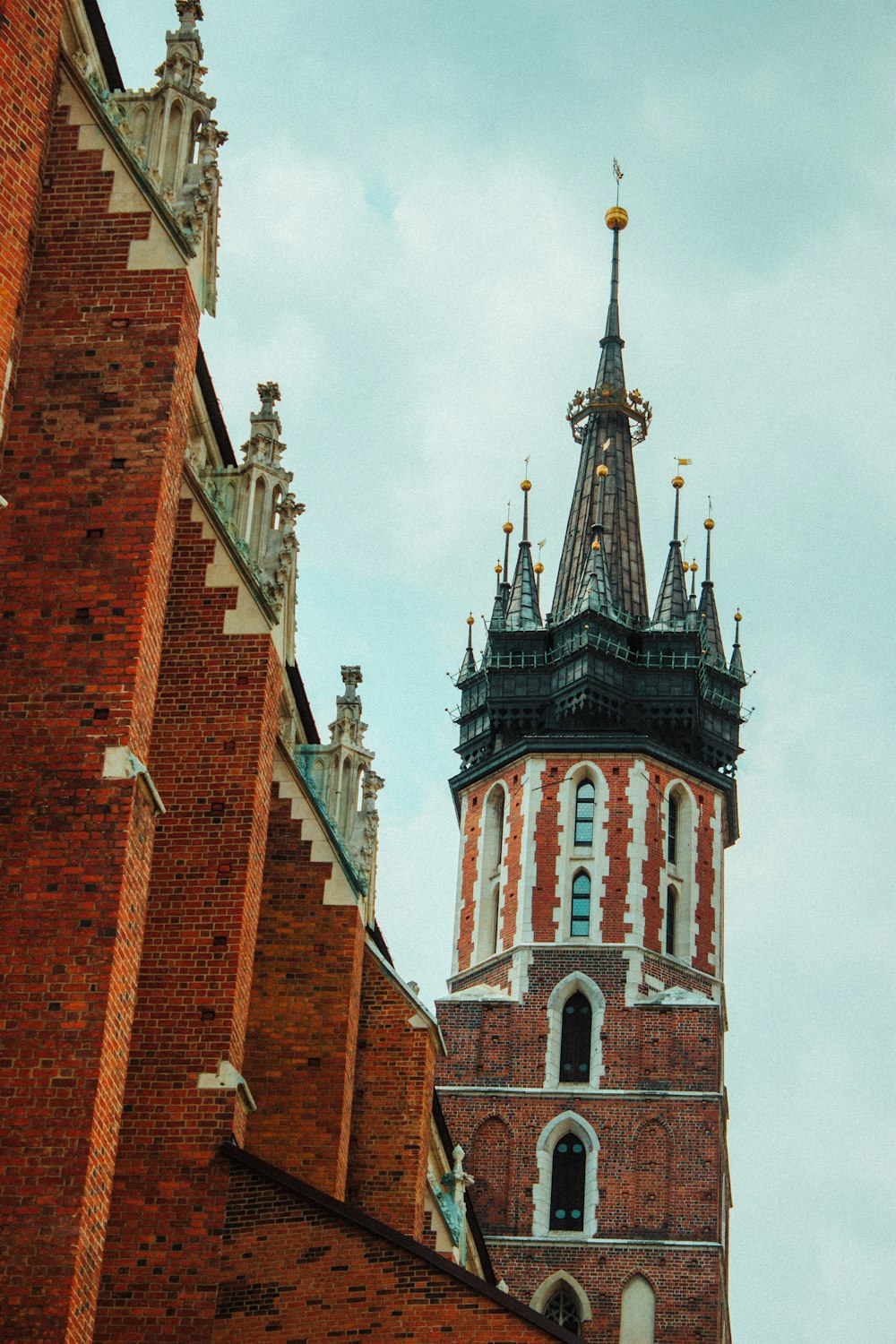 a tall brick building with a tall tower