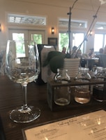 A marketing consultation session in progress, with notes and barrel samples spread across a wooden table.